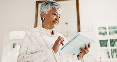 Buy stock photo Mature, woman and scroll in living room with tablet, browsing website and watch social media video. Calm, person and online application in home with digital tech, internet connection and wellness.