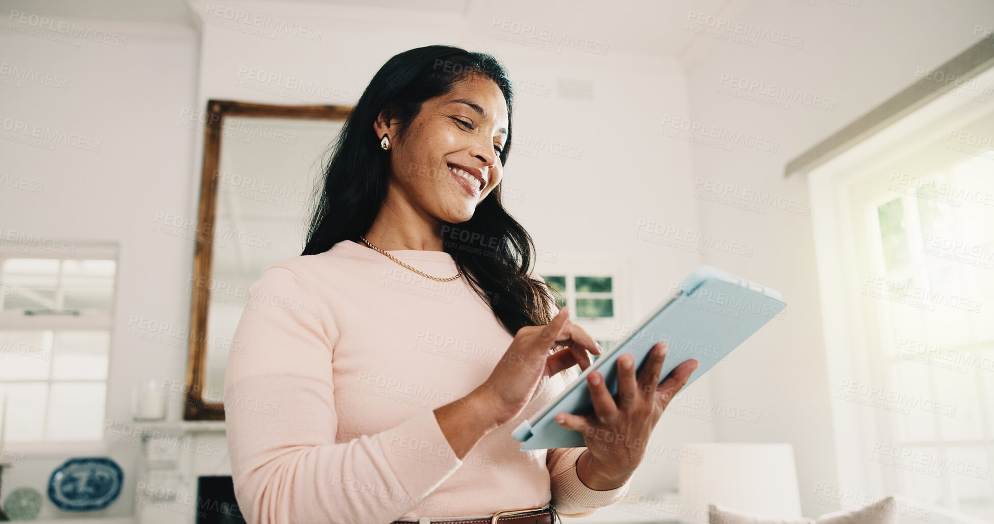 Buy stock photo Tablet, freelancer and woman in home with research, story editing or happy with manuscript draft. Tech, remote work and person reading review on internet, creative chapter and author publication