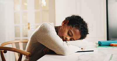 Buy stock photo Child, tired and sleeping in home with homework, overworked and learning fatigue at table. Boy, education and exhausted in living room with rest, burnout and break from information overload with nap