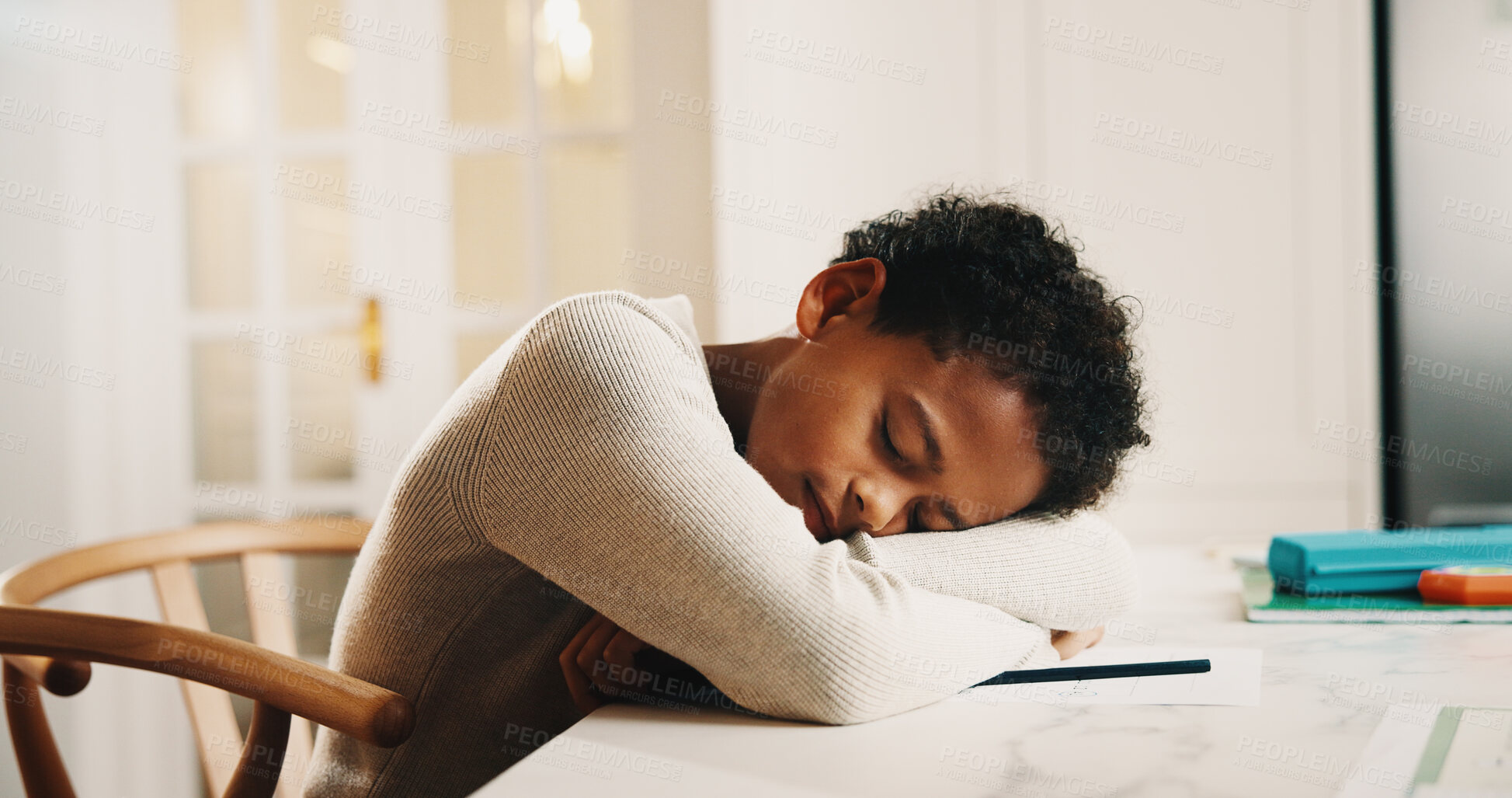Buy stock photo Child, tired and sleeping in home with homework, overworked and learning fatigue at table. Boy, education and exhausted in living room with rest, burnout and break from information overload with nap
