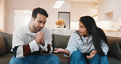 Buy stock photo Argument, upset and couple on sofa in home for cheating, affair or divorce with toxic marriage. Fighting, disagreement and man with woman for conflict in relationship with breakup in living room.