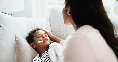 Buy stock photo Comfort, mom and kid in home with thermometer, childcare and health monitor with flu symptoms. Support, mother or child in living room with tech, parenthood or temperature check in illness assessment