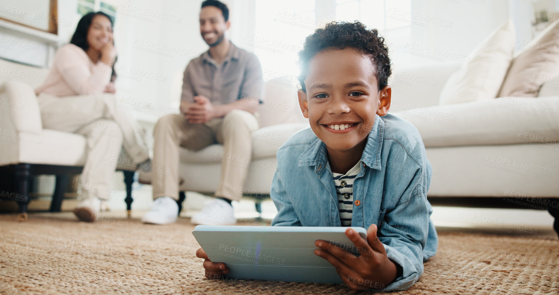 Buy stock photo Portrait, boy and tablet with smile on floor in living room for learning or online gaming in family home. App, development and parents with child together for education, relax or streaming service
