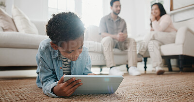 Buy stock photo Game, child and tablet with relax on floor in living room of family home for learning or online. App, development and parents with boy in house together for tech, education or streaming service