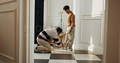 Buy stock photo Getting ready, dad and son in house with shoelaces, parent support and childcare in morning routine. Bonding, father or child with tying shoes, outfit preparation or family assistance at start of day