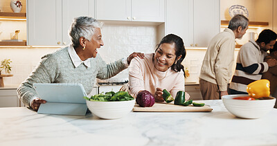 Buy stock photo Cooking, tablet and woman with senior mother in kitchen at house for preparing meal together. Laugh, digital technology and adult daughter with elderly mom for online recipe with nutrition dinner.
