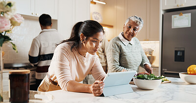 Buy stock photo Cooking, tablet and woman with senior mom in kitchen at house for preparing meal together. Laugh, digital technology and adult daughter with elderly mother for online recipe with nutrition dinner.
