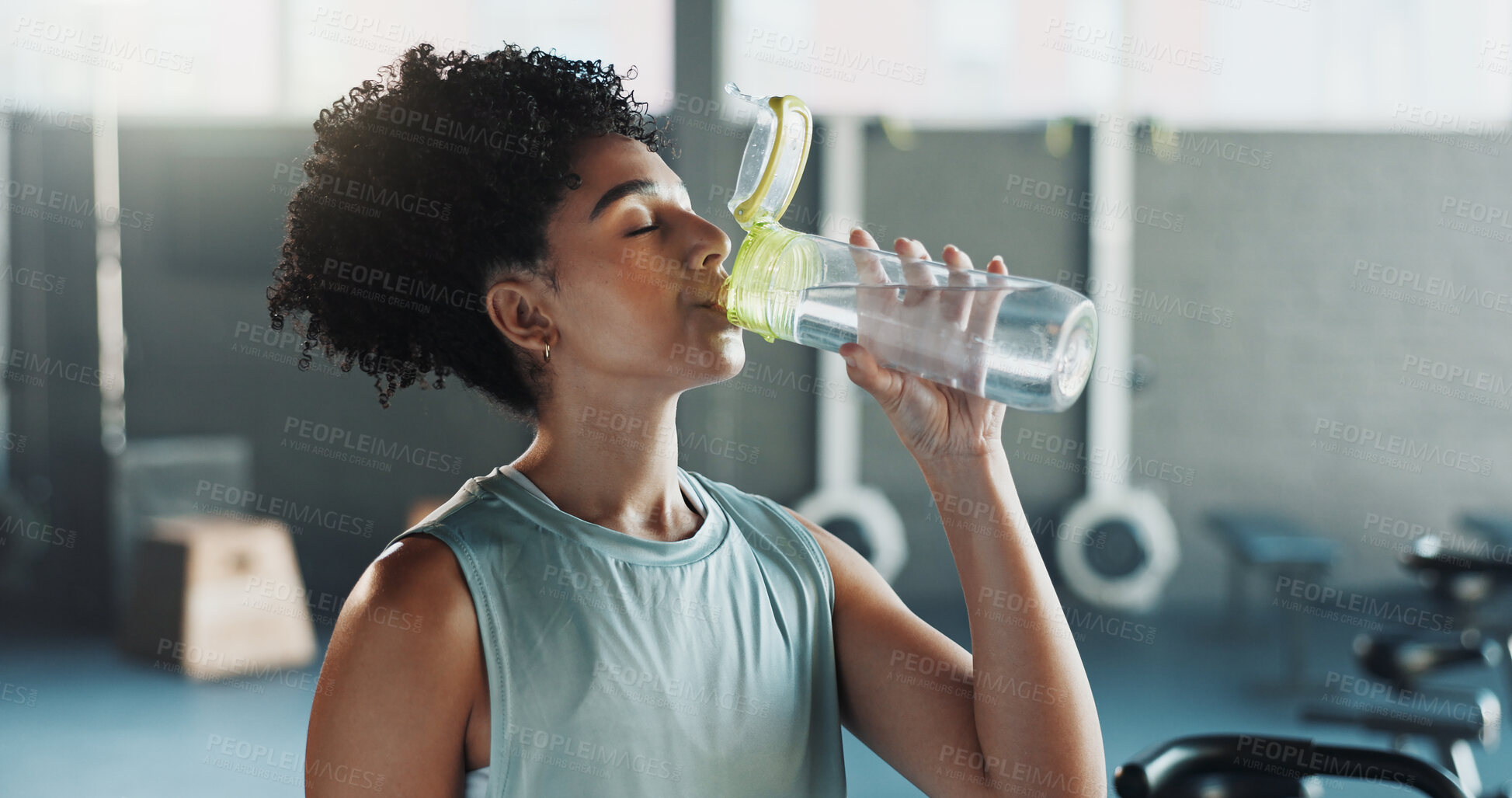 Buy stock photo Thirsty, woman and drink water in gym with break, healthy habits and vitality benefits for wellness. Active, person and exercise recovery in fitness club for hydration, electrolytes and nutrition.