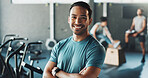Portrait, happy man and personal trainer with confidence in gym for fitness, workout or training. Active, male person or coach with smile or arms crossed for wellness or assistance in health club