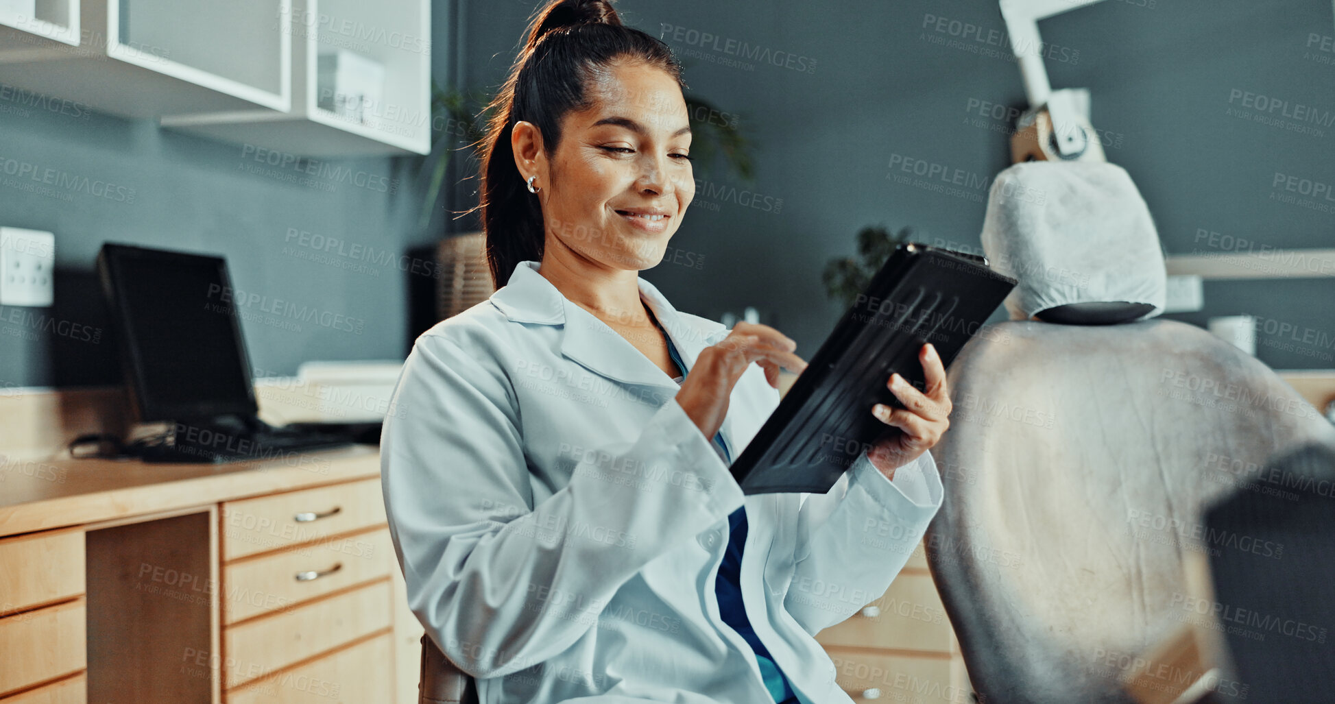 Buy stock photo Happy, dentist and reading at clinic with tablet, research and test results for dental care. Smile, woman and review with digital app for dentistry, appointment details and information for treatment