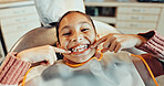 Above, child and chair with smile for dentistry, appointment and satisfaction for teeth whitening. Portrait, kid and happy at dental clinic for checkup, cleaning mouth and treatment for oral hygiene