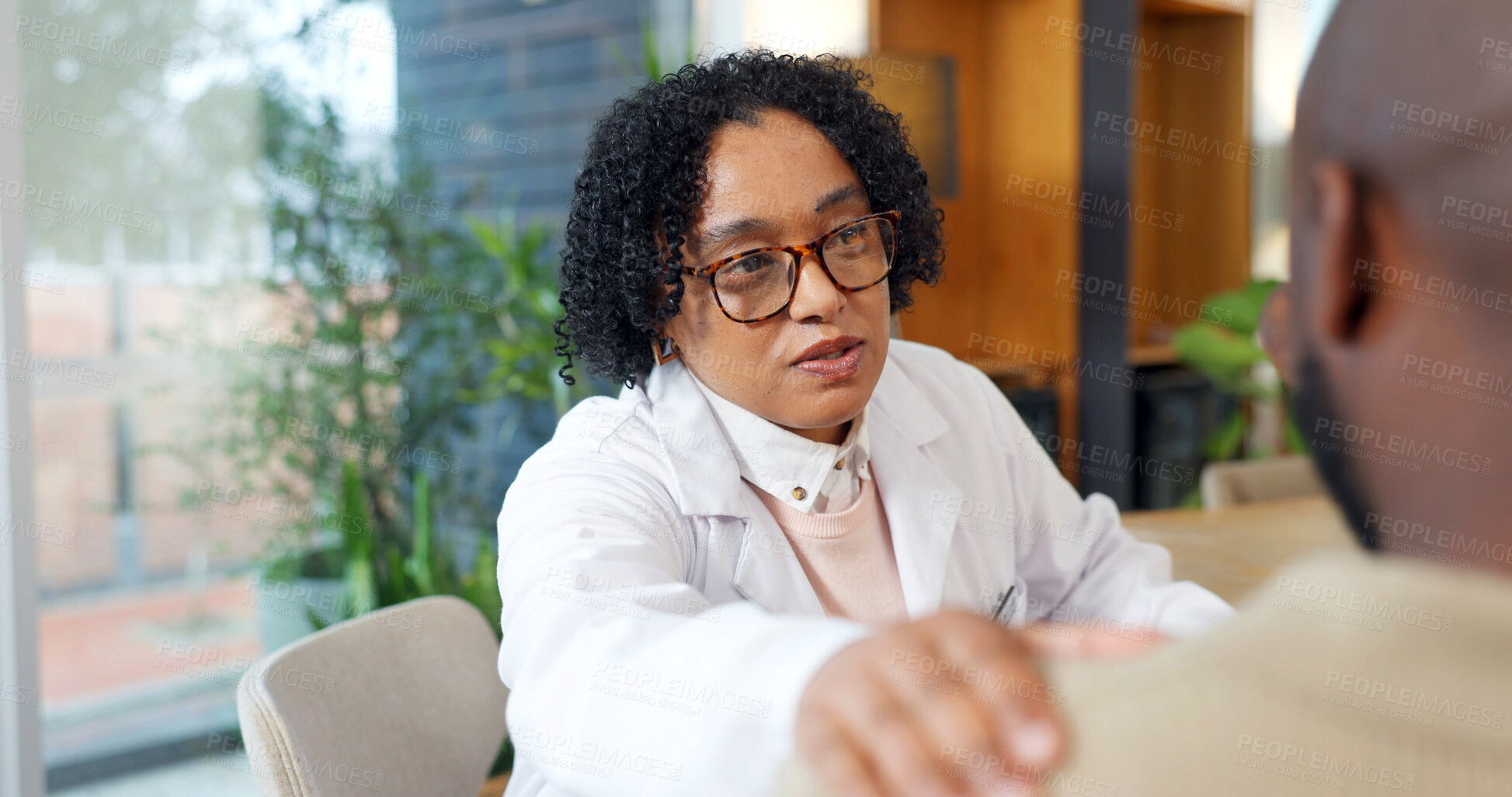 Buy stock photo Healthcare, doctor and man with help, consultation and conversation with checkup or support. Male patient, medical advice and professional in office, discussion or appointment with treatment feedback