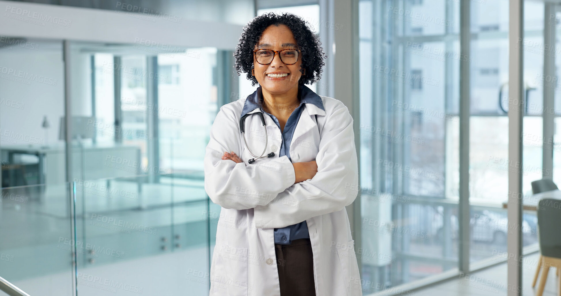 Buy stock photo Happy, woman and doctor at hospital with portrait, career pride and about us for medical wellness. Smile, mature person and crossed arms in workplace with ambition, consultant and healthcare services