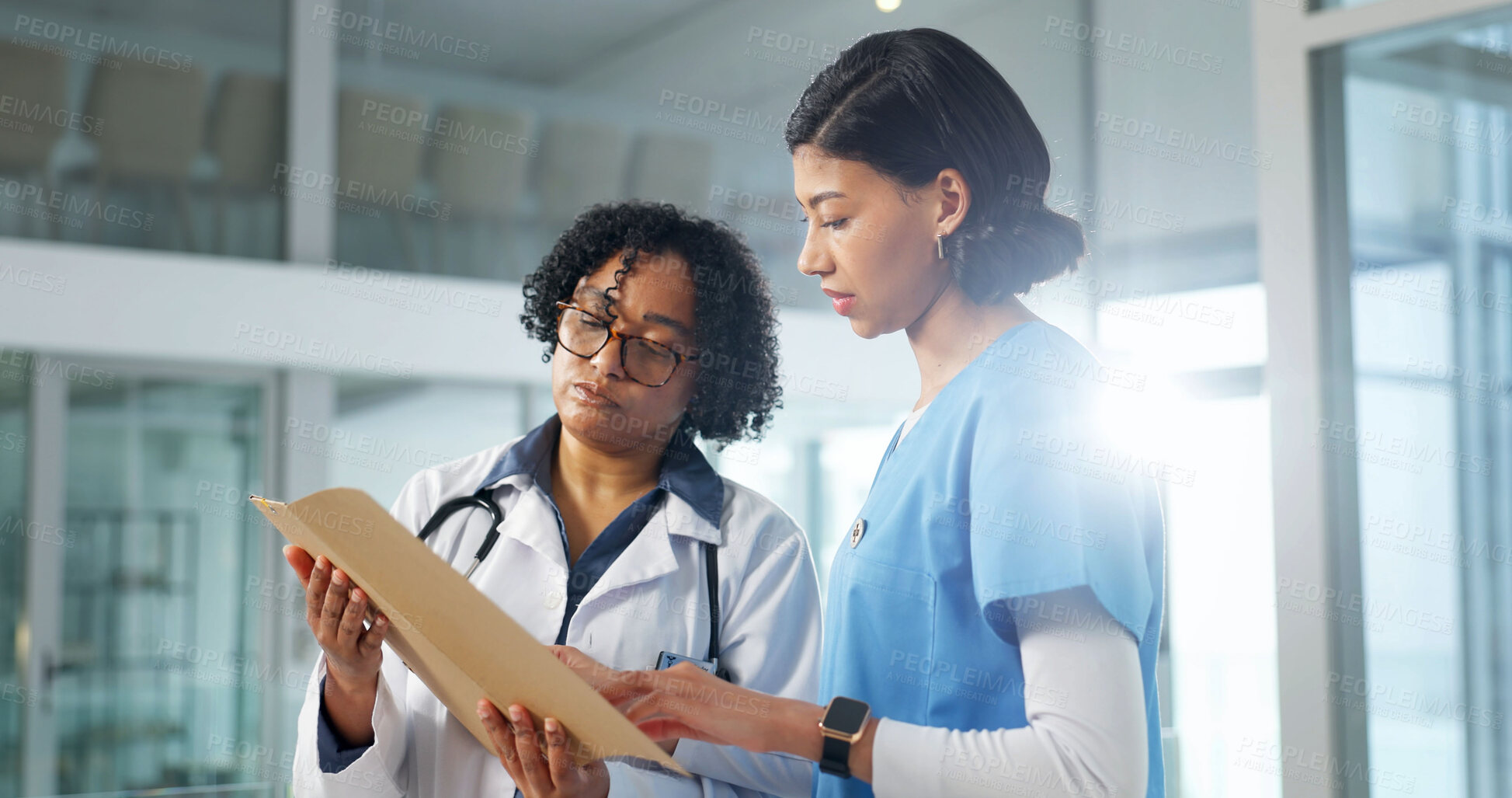 Buy stock photo Doctor, documents and nurse in clinic with discussion, feedback or treatment plan with flare. Intern, physician and women in hospital with meeting, paperwork and medical service with patient records