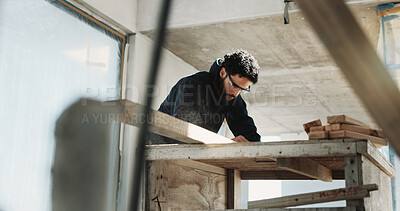 Buy stock photo Man, carpenter and goggles for construction with wood, restoration and furnishing for expansion. Male person, safety and timber at site for carpentry, smooth surface and woodworking for renovation