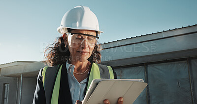 Buy stock photo Construction, engineer and woman with tablet outdoor, building development or review site report. Tech, happy mature contractor and person with engineering design, project schedule or quality control