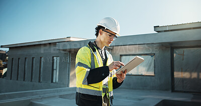 Buy stock photo Engineer, outdoor and man with tablet, scroll or plan for property development on construction site. Civil engineering, person and quality assurance with tech, research and renovation project on roof
