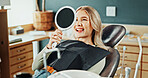Woman, smile and healthcare with mirror for teeth whitening, results and oral hygiene at dentist clinic. Happy, patient and dental care at orthodontist for tooth cleaning, veneers and implants