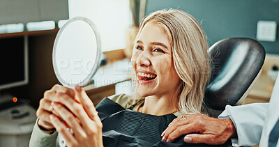 Buy stock photo Woman, smile and dentist with mirror for oral hygiene, results and teeth whitening at dental clinic. Happy, patient and healthcare at orthodontist for tooth cleaning, lick veneers or medical implants