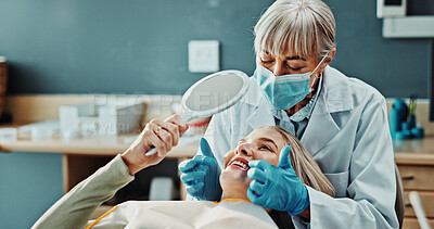 Buy stock photo Woman, happy and dentist with mirror for teeth whitening, results and oral hygiene at dental clinic. Smile, patient and healthcare at orthodontist for tooth cleaning, veneers and medical implants