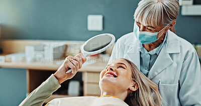 Buy stock photo Woman, happy and dentist with mirror for veneers, results and oral hygiene at dental clinic. Smile, patient and healthcare at orthodontist for tooth cleaning, teeth whitening and medical implants