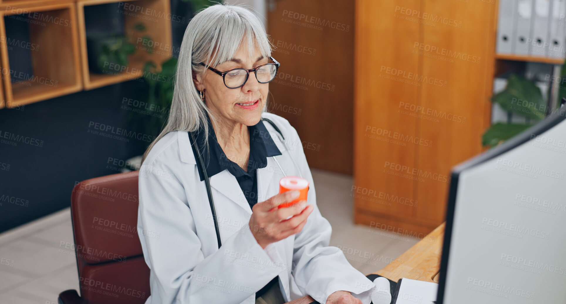 Buy stock photo Doctor, video call and woman with medicine in clinic, talking or explaining side effects on website. Hospital, telehealth and mature person with pills, consultation and medical advice with computer