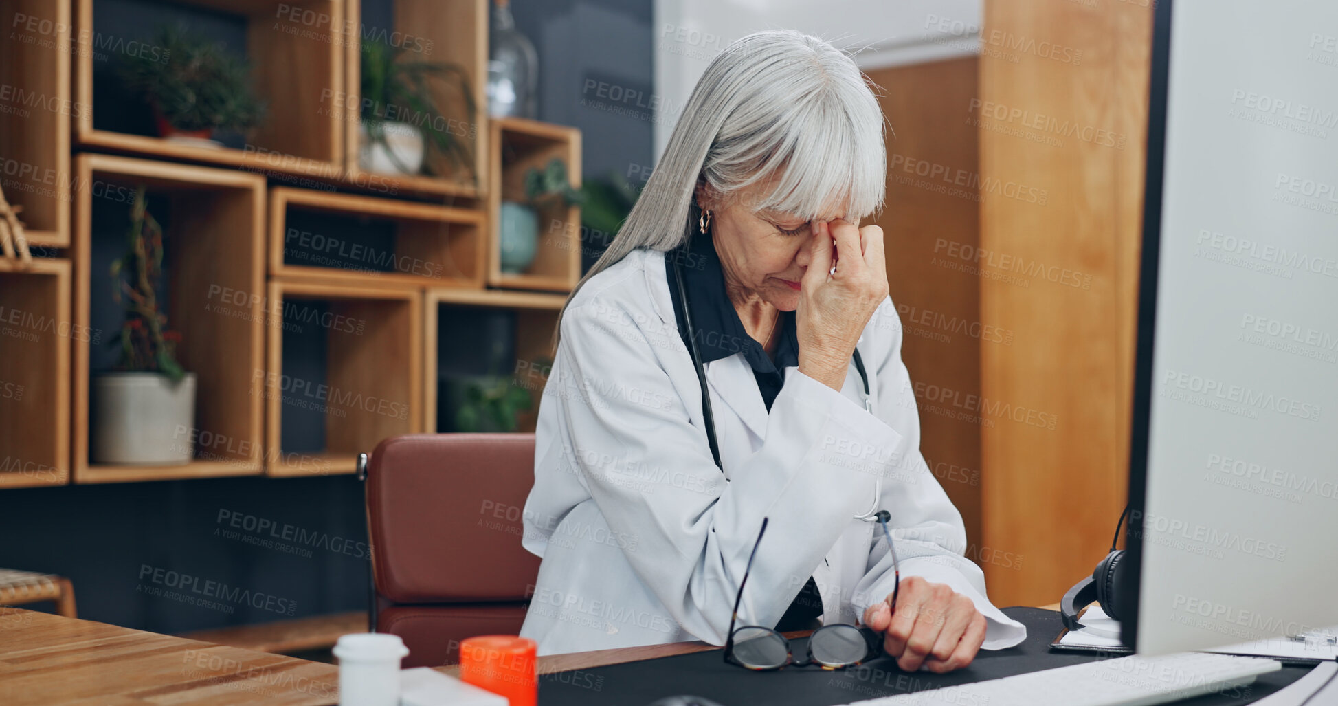 Buy stock photo Stress, headache and doctor in office at hospital with fatigue, burnout or bad news on patient results. Woman, migraine and mature healthcare worker with exhaustion for medical mistake in clinic.