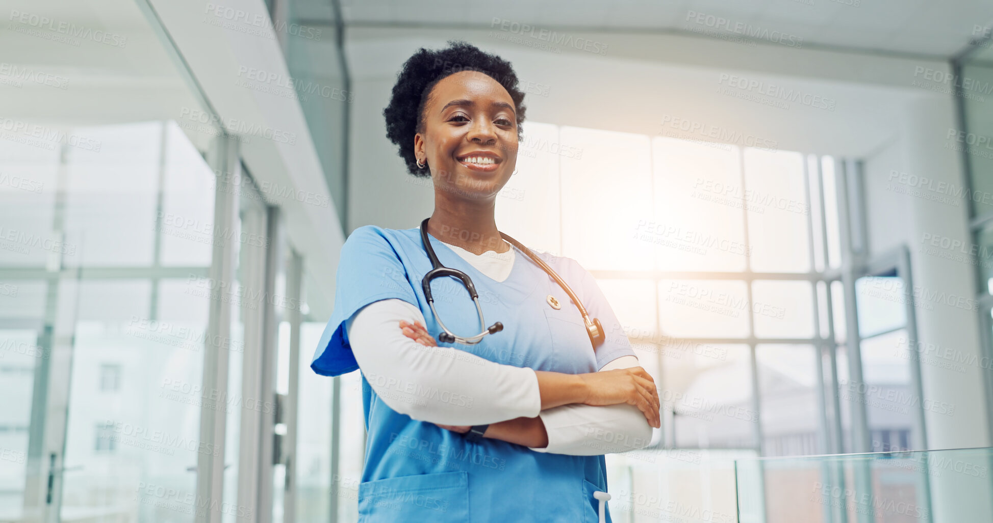 Buy stock photo Happy, doctor and arms crossed in clinic for medical confidence, cardiology specialist and trust. Heart health expert, black woman and smile portrait for cardiac care, healthcare service or integrity