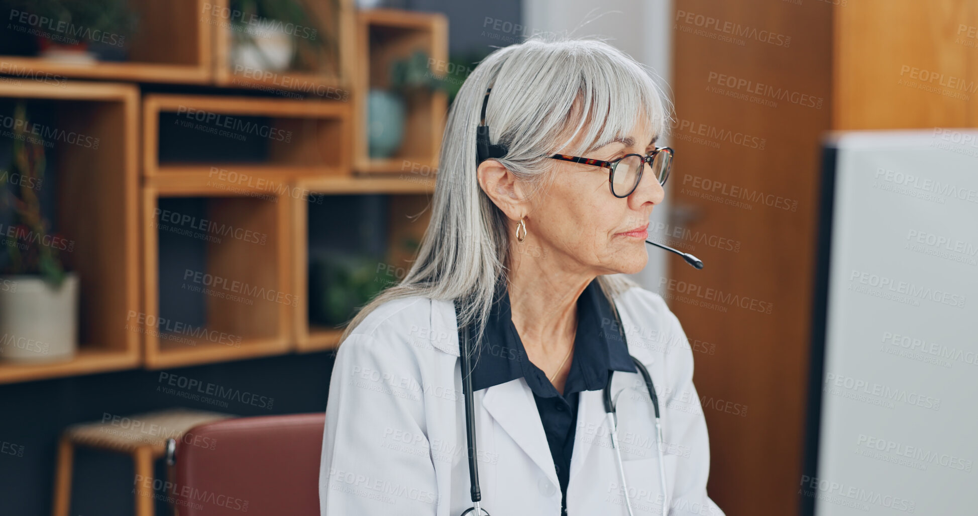 Buy stock photo Clinic, doctor and woman with headset, video call and health services with computer or consultation. Healthcare, advice and mature person with tech, online and communication with contact in hospital