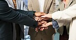Meeting, business and people with hands together for unity, collaboration or company mission. Group, employees or piling with stack, group or trust for teamwork, solidarity or support in workplace