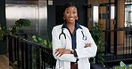 Portrait, doctor or black woman with pride for medical assistance, help or hospital support. Female person, healthcare worker or professional with smile or arms crossed for health advice or service