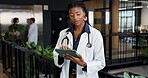 Woman, doctor and reading at hospital with tablet, research and blood test results for diagnosis. Female person, surgeon and review at clinic with tech, mri scan report and medical records for health