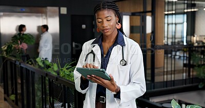 Buy stock photo Woman, doctor and reading at hospital with tablet, research and blood test results for diagnosis. Female person, surgeon and review at clinic with tech, mri scan report and medical records for health