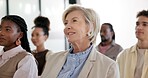 Audience, woman and conference for business training, development and listen to upskill workshop. Mature person, smile and group together for corporate event, meeting and presentation for staff