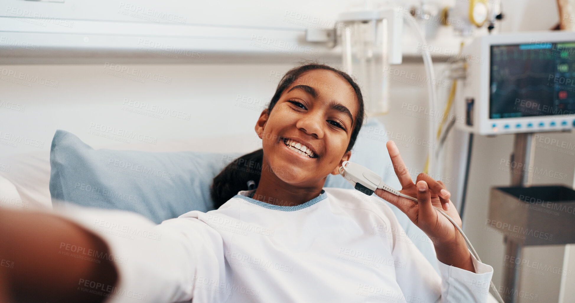 Buy stock photo Child, patient and happy girl with peace sign for selfie, medical memory or app in hospital bed. Portrait, kid or smile with emoji for healthcare treatment, social media picture or photography