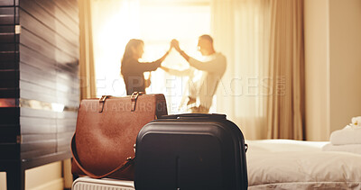 Buy stock photo Couple, travel or dancing with bag in bedroom for honeymoon trip, romantic getaway or accommodation. Man, woman and lens flare with window, love or luggage in hotel for weekend or holiday together