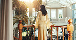 Back, woman and balcony at resort for holiday, adventure and guest exploring at accommodation. Female person, tourist and terrace at retreat with scenic view, travel experience and weekend vacation