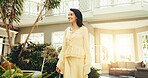 Happy, woman and walk at resort for holiday, adventure and guest exploring at luxury accommodation. Smile, mature person and checkin at retreat with scenic view, travel experience and weekend getaway