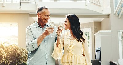 Buy stock photo Cheers, travel and happy couple with glass in resort for holiday getaway or vacation together. Man, woman or smile with alcohol, drink or toast for weekend trip, date or honeymoon in luxury retreat