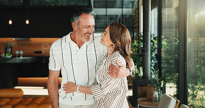 Buy stock photo Happy, hug and mature couple in living room with love, companion and bonding together for connection. People, smile and embrace in home with romantic relationship, wellness and support for partner.