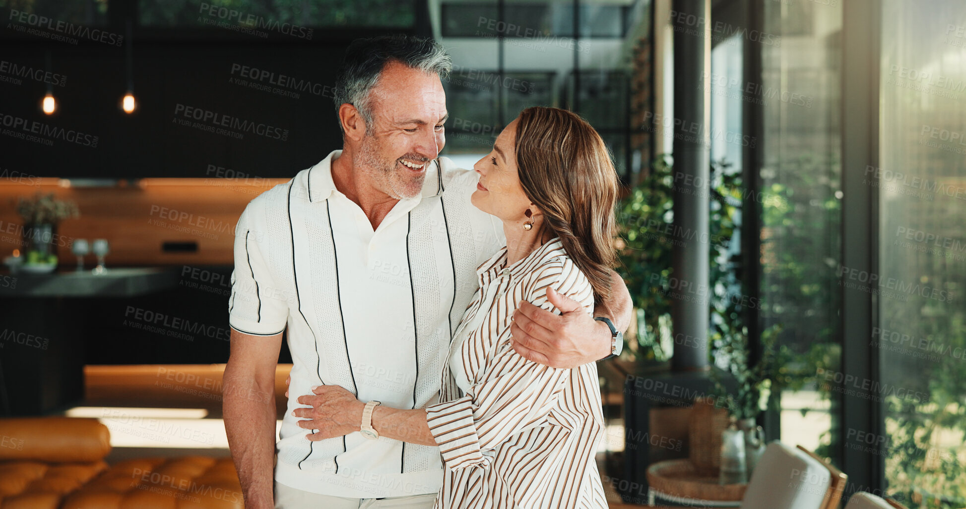 Buy stock photo Happy, hug and mature couple in living room with love, companion and bonding together for connection. People, smile and embrace in home with romantic relationship, wellness and support for partner.