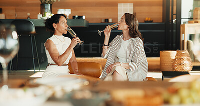 Buy stock photo Friends, relax and drink champagne in living room with weekend hangout, trust and bonding together. Mature women, chill and visit in home with alcohol, social connection and unwind for stress relief.