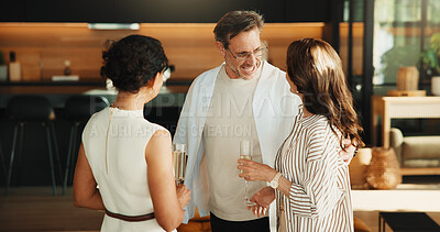 Buy stock photo Happy, friends and conversation in living room with drinks, social connection and visit on weekend. Mature people, relax and discussion in home with champagne, gossip and hangout for stress relief.