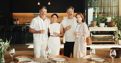 Buy stock photo Celebration, portrait and friends in home with champagne, bonding and happy moment with reunion meal. Smile, drink and mature people with dinner, party connection and good time with social gathering.