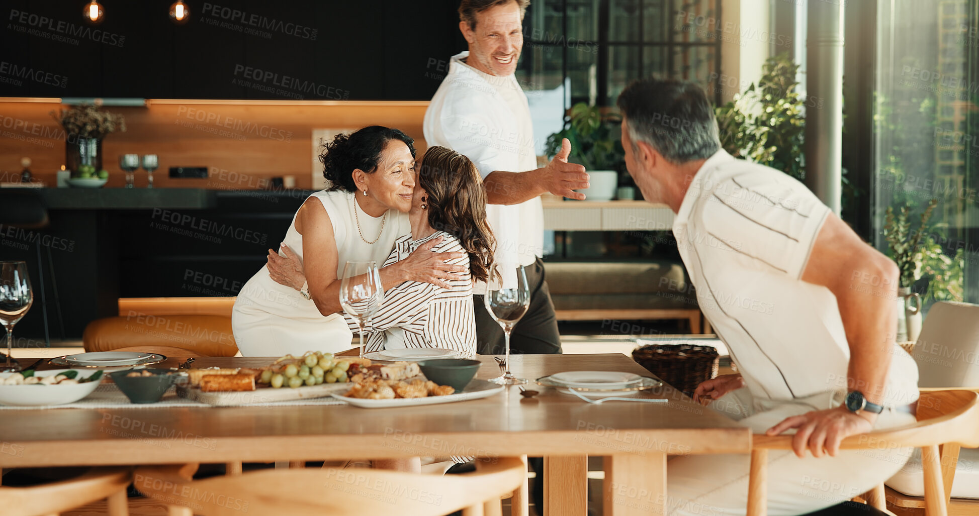 Buy stock photo Mature, people and greeting with hug in home for reunion, welcome or social gathering together. Group, couple of friends and handshake for embrace, introduction and bonding for celebration in house