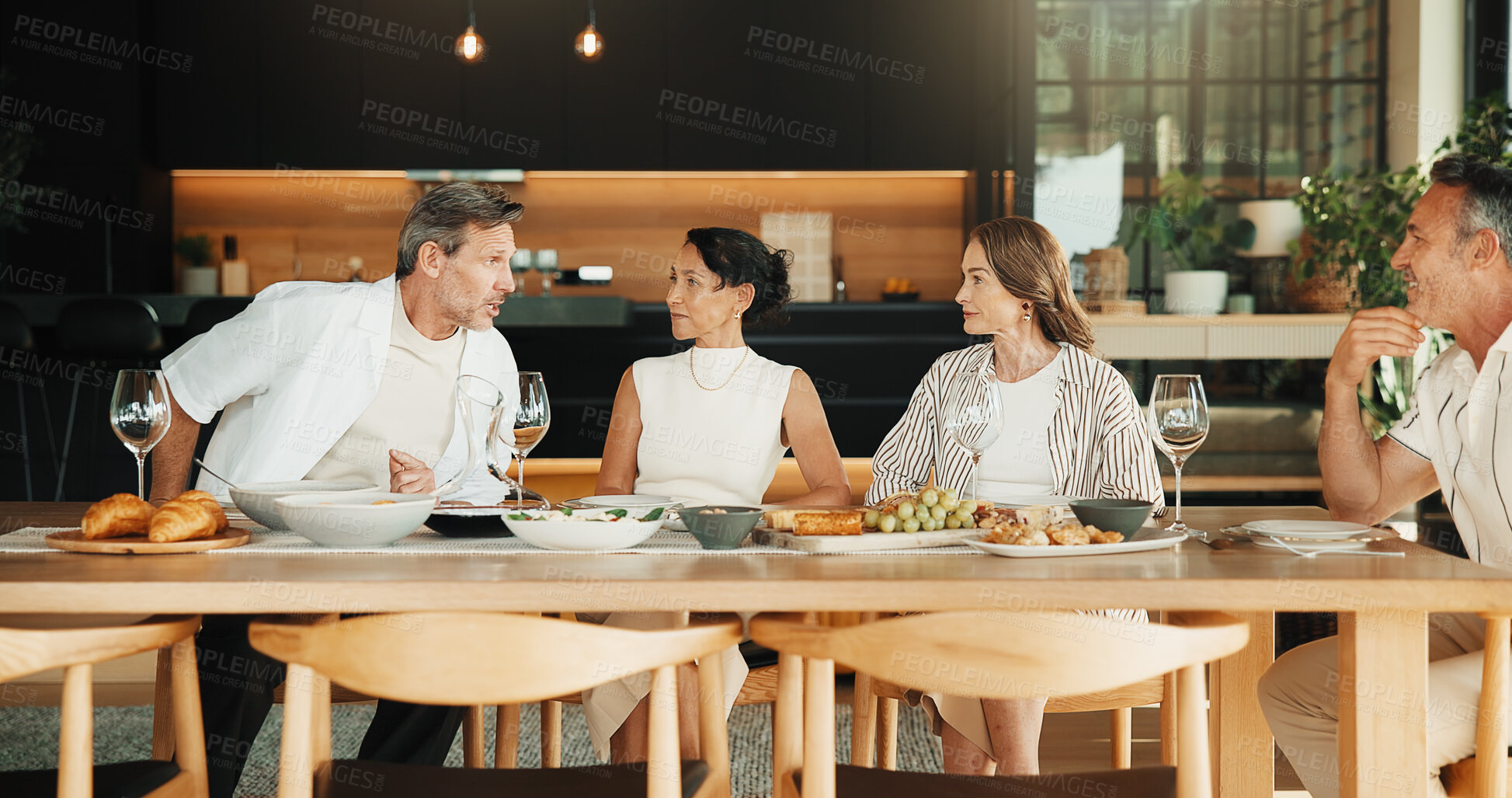 Buy stock photo Celebration, discussion and friends in home with food, bonding and reunion with meal together. Smile, gossip and mature people with dinner, party connection and good time with social gathering.