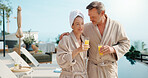 Drinks, happy couple and hug by swimming pool for love, summer vacation and bonding together. Poolside, mature man and woman with mimosa cocktail, holiday and embrace at luxury resort with care