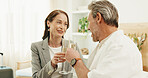 Couple, travel and smile with champagne in hotel, laughing and celebration with partner or together. Relationship, commitment and happy mature people with alcohol, toast and anniversary in motel