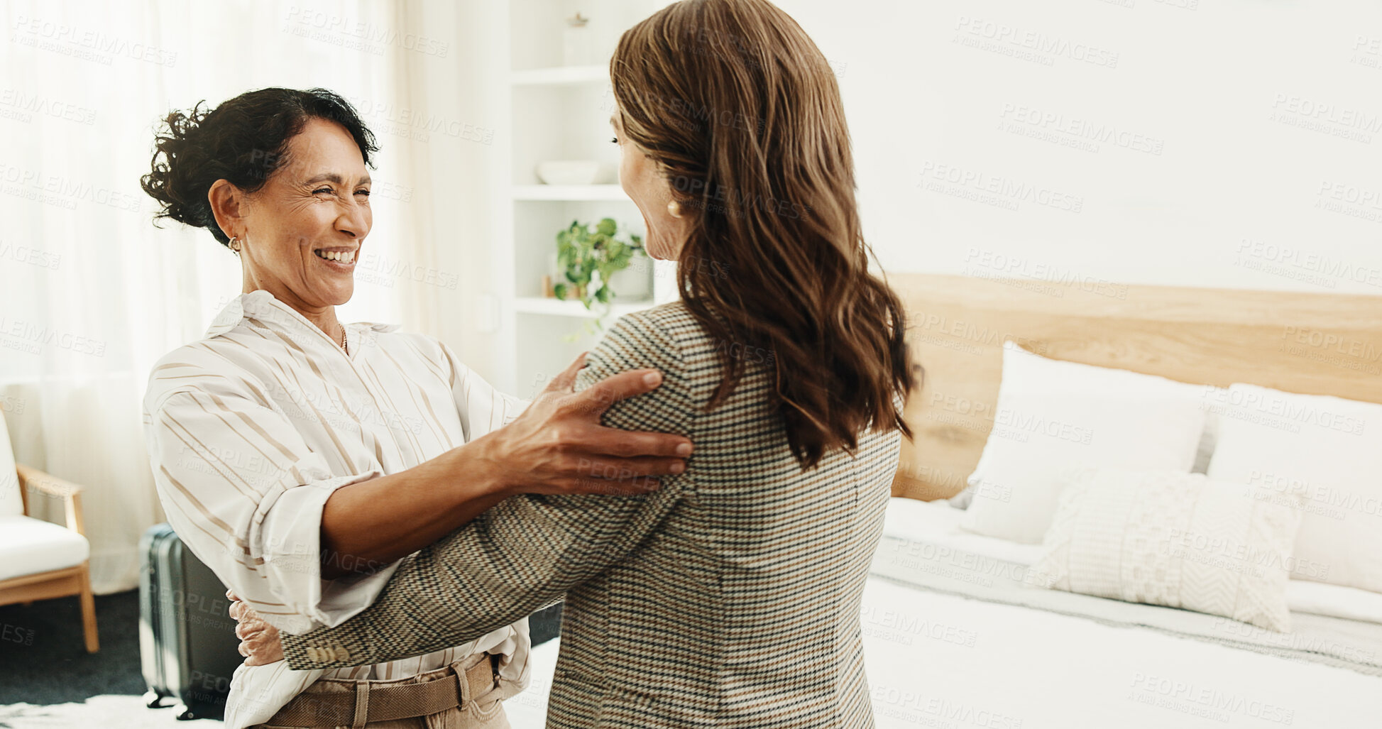 Buy stock photo Visit, greeting and women in home with hug, bonding together and excitement with friendship reunion. Space, companion and mature people with embrace, friendly welcome and happy moment with connection