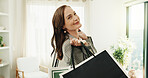 Portrait, woman and shopping in home for fashion, clothing haul and purchase for retail therapy. Smile, mature person and bags in lounge with new outfit, collection and discount for wardrobe restock